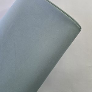 پارچه کرپ مازراتی درجه یک رنگ سبز ماچا مناسب دوخت مانتو و لباس مجلسی